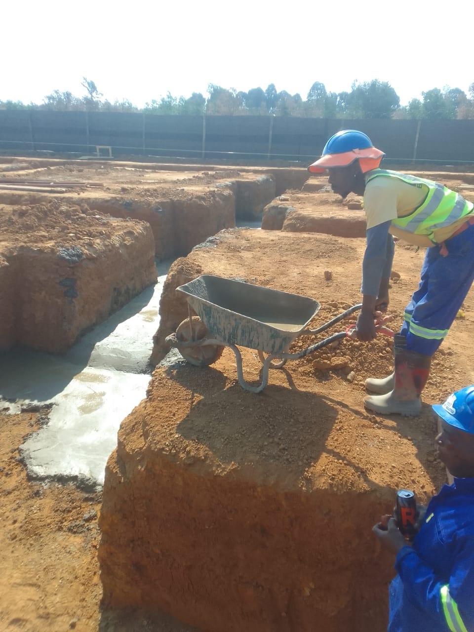 Construction worker excavating at Three Fountains Mall site